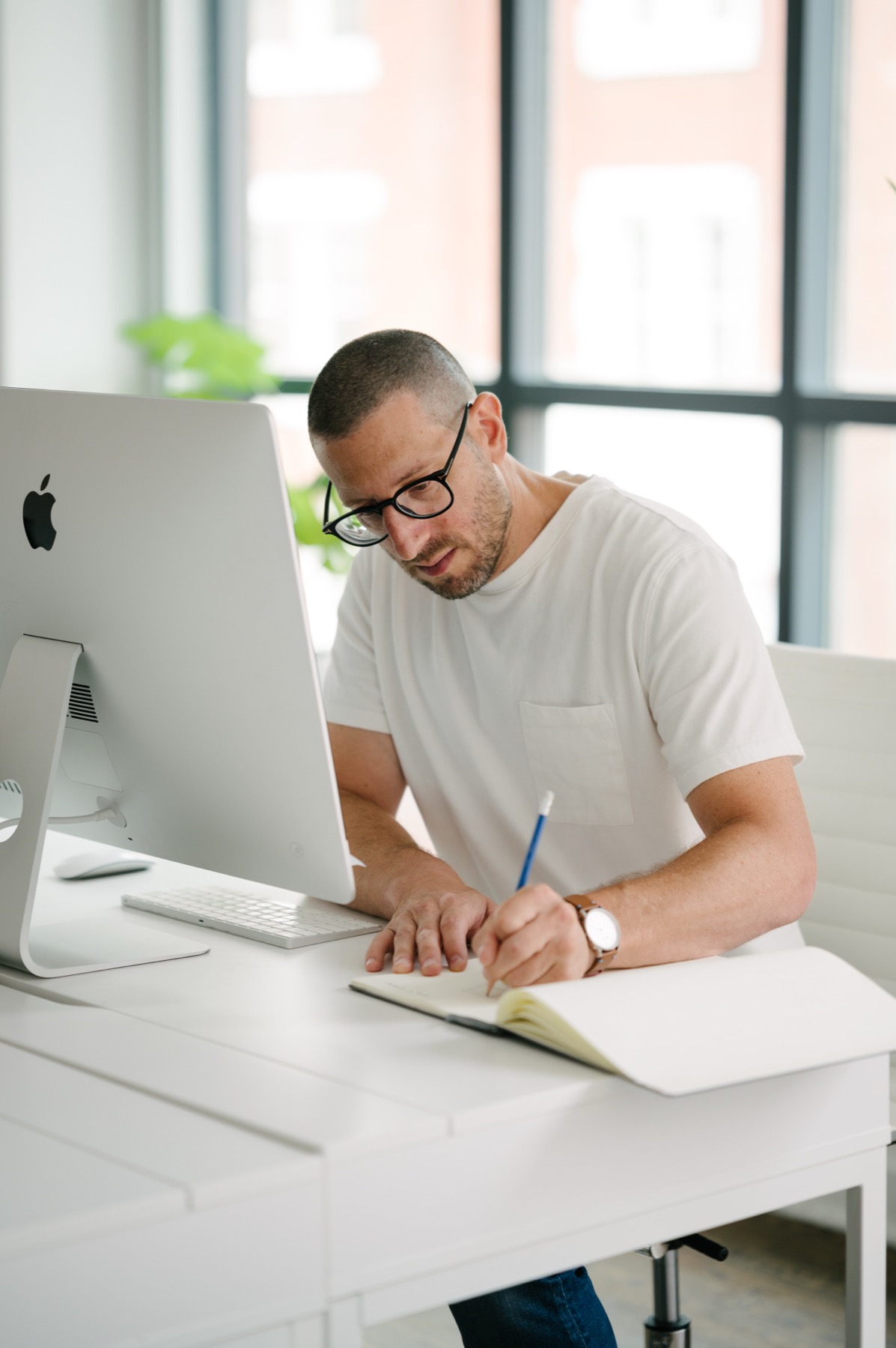 Jason Goodman writing at his desk