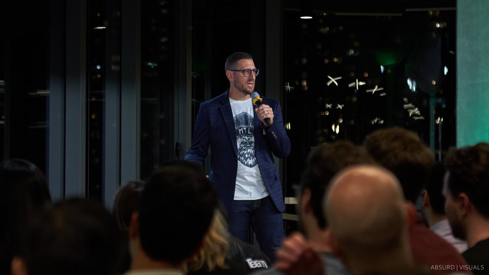 Jason Goodman speaking to a room of founders